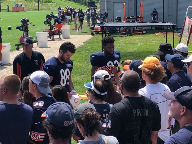 Chicago Bears Tight End Stephen Carlson (Left) and running back Roschon Johnson sign autographs after the practice. (Daniel I. Dorfman for the Lake County News-Sun)