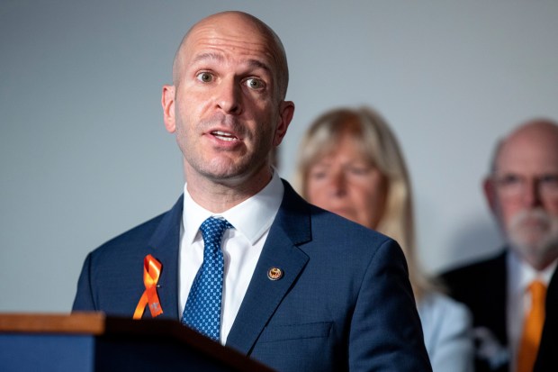 Illinois state Rep. Bob Morgan, D-Deerfield, speaks during a press conference surrounded by anti-gun violence advocates, many of whom have a connection to the recent Highland Park shooting, at the Capitol in Washington on July 20, 2022. Researchers and community activists told lawmakers Thursday, Dec. 15, that removing guns from the streets of cities in the state will help curb gun violence like the mass shooting at a July 4th parade in Highland Park, Ill., but that it must be followed up with programs to change attitudes and give people alternatives and hope.