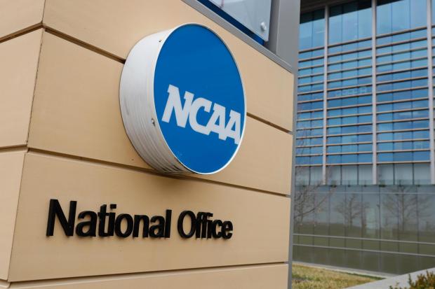 Signage at the headquarters of the NCAA is viewed in Indianapolis on March 12, 2020. (AP Photo/Michael Conroy)