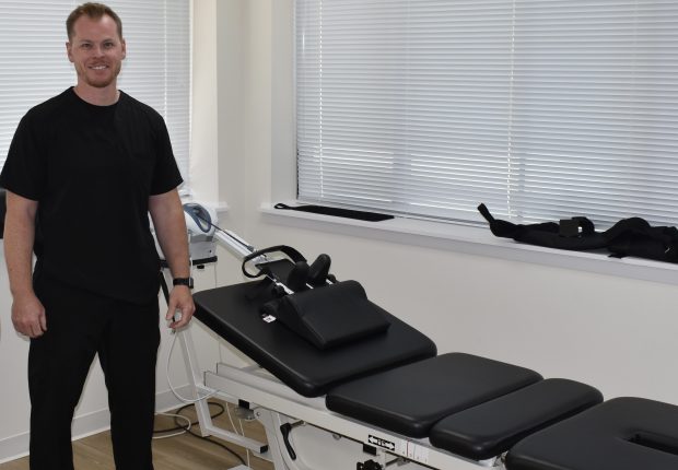 This machine helps with a variety of spine issues, said Dr. Mike Genslinger, owner of Renew Health & Wellness in Naperville. Football injuries treated successfully by a chiropractor inspired him to go into the profession, he said. (Steve Metsch/Naperville Sun)