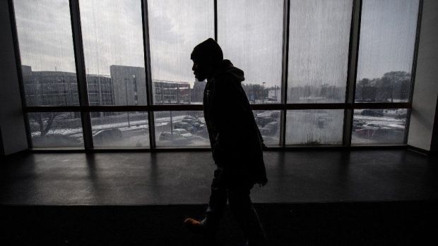 A man walks past a window in the Adam Benjamin Jr. Metro Center in Gary on Friday, January 25, 2019.