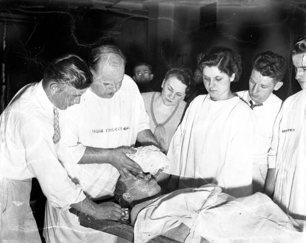 Professor D.E. Ashworth lifts a plaster "death mask" off the face of John Dillinger while his students watch on July 23, 1934, at the Cook County morgue in Chicago. Ashworth, of the Worsham College of Mortuary Science, had told employees at the morgue that he had permission to create the mask, but he did not. Ashworth and his students were ousted from the morgue, and the partially completed mask was confiscated by the police. (Chicago Tribune historical photo)