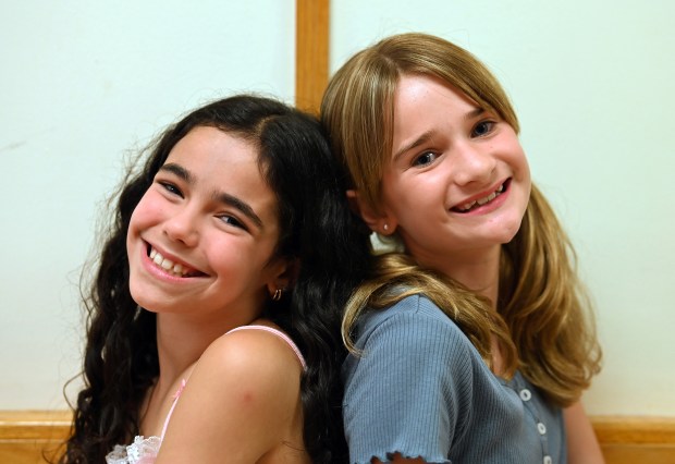 From left, Brielle Horwitch, 10, a rising fifth-grader of Northbrook and Lanah Vurnakes, 11, a rising sixth-grader of Glenview, are photographed on Sunday, July 7, 2024 after a West Ridge Center (636 W. Ridge Road) rehearsal in Highland Park of Les Misérables by the Uptown Music Theater of Highland Park. (Karie Angell Luc/Pioneer Press)