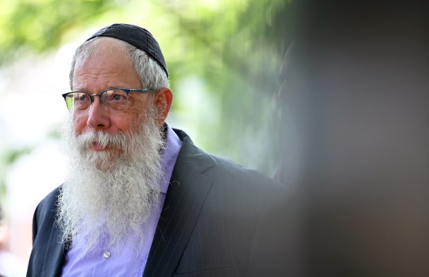 Retired Evanston Police Department Chaplain Rabbi Dov Hillel Klein of Evanston, director of Chabad of Evanston, is in the audience at the July 22, 2024 First Responder Remembrance Ceremony at Firemen's Park in Evanston. (Karie Angell Luc/Pioneer Press)