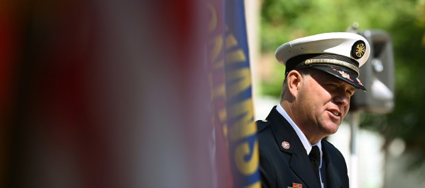 Right, Evanston Fire Chief Paul J. Polep addresses the audience at the July 22, 2024 First Responder Remembrance Ceremony at Firemen's Park in Evanston. (Karie Angell Luc/Pioneer Press)