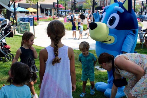 Bluey stopped by to chat with the kids at the Wilmette Sidewalk Sale held from July 12 through 13. (Gina Grillo/Pioneer Press)