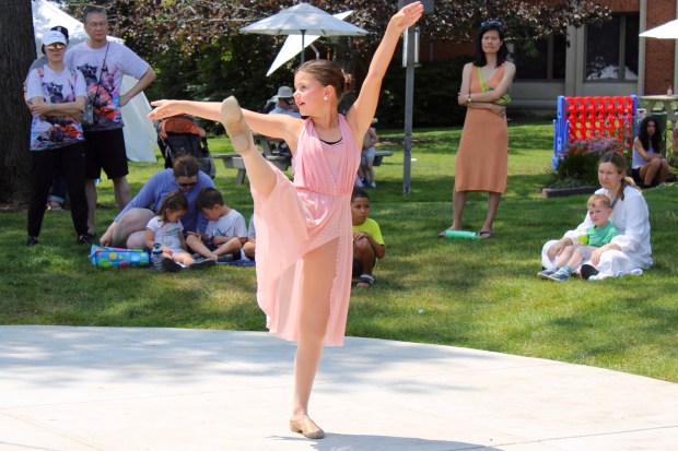 Libby Sutphen age 9, of Winnetka performs as part of a show by students from Studio North Academy for Performing Arts during the Wilmette Sidewalk Sale. (Gina Grillo/Pioneer Press)