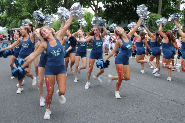 The New Trier High School Dance Team entertains the crowd during Winnetka's Fourth of July Parade down Elm Street. (Gina Grillo/Pioneer Press)