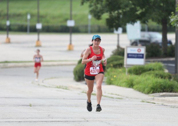 A runner finishes during the Advocate Health Family Fitness Run July 4, 2024 in Barrington. (Trent Sprague/for the Pioneer Press)