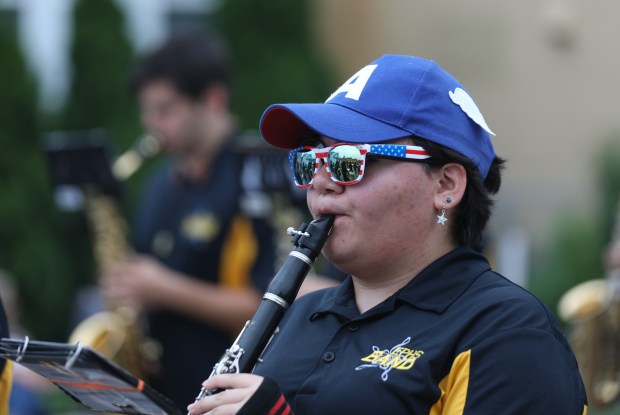 Alexis Casdana, of the Elmwood Park High School Marching Band, wears American flag glasses during a Fourth of July parade in Elmwood Park on Thursday, July 4, 2024. (Trent Sprague/for the Pioneer Press)