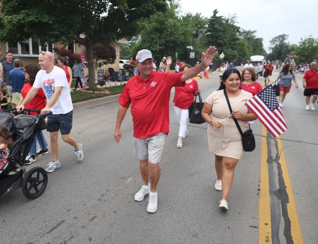 Elmwood Park Village President Angelo Saviano waves to spectators during a Fourth of July parade in Elmwood Park on Thursday, July 4, 2024. (Trent Sprague/for the Pioneer Press)