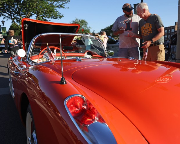 Ralph Gillett, left, and 1957 Chevrolet Corvette owner Tom Mahoney, both from Elmwood Park, talk cars during the Summer in the Circle car show June 14, 2024 in Elmwood Park. (H. Rick Bamman /for Pioneer Press)