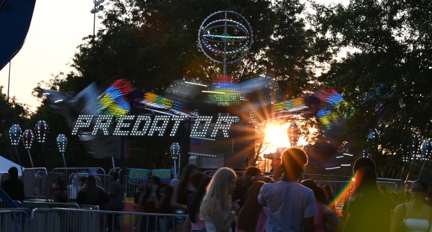 The sun is about to drop behind the horizon at Lincolnwood Fest on July 26, 2024 in Lincolnwood at Proesel Park. (Karie Angell Luc/Pioneer Press)