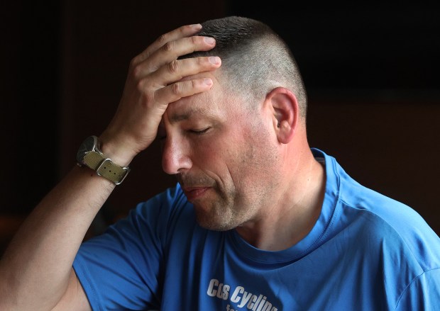 Indiana State Police Sgt. Kevin Getz starts to break down as he talks about the death of a close friend. Getz and the group rode in from Valparaiso during the 23rd annual Cops Cycling for Survivors bicycle ride around Indiana comes through the region. The ride pays respect to Indiana's fallen law enforcement heroes. The event lets their survivors know they and their loved ones are not forgotten. Riders stopped at the Fairfield Inn at Merrillville on Friday, July 12, 2024. (John Smierciak/for the Post Tribune)