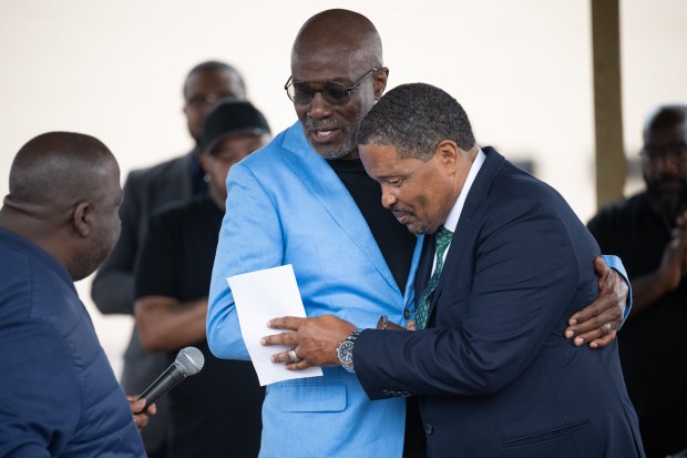 Pastor Maurice White, Jr., of Beyond 4 Walls Christian Center, on right, shakes hands with Bishop Noel Jones, senior pastor of City of Refuge Church in Gardena, California, during an event to celebrate the opening of the Harvest Square Strip Mall in Gary on Tuesday, July 9, 2024. (Kyle Telechan/for the Post-Tribune)