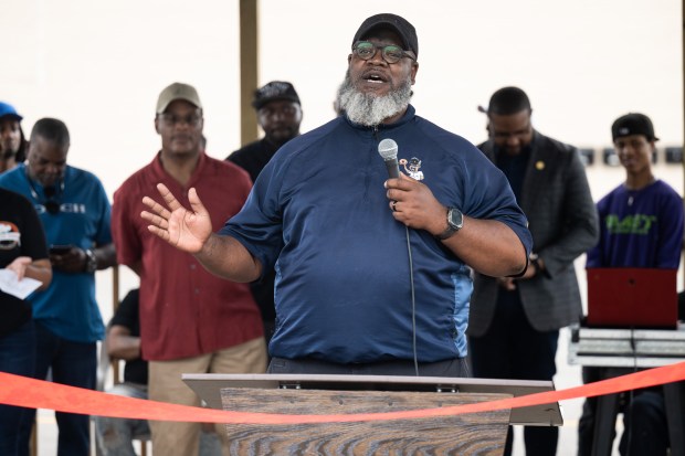 No'Val Alexander, owner and founder of New Age Baking Company, speaks during a ribbon-cutting celebration at the Harvest Square Strip Mall in Gary on Tuesday, July 9, 2024. (Kyle Telechan/for the Post-Tribune)