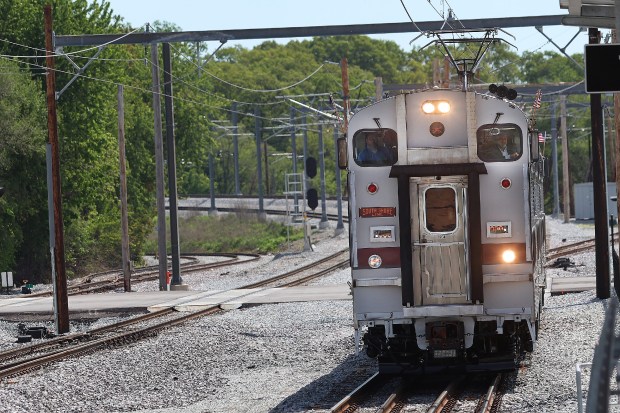 Indiana Gov. Eric Holcomb arrives (right window) during a ribbon-cutting ceremony at the Miller Station in Gary to commemorate the South Shore Line Double Track NWI Project on Monday, May 13, 2024. (John Smierciak/for the Post-Tribune)