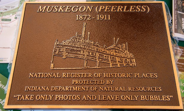 A plaque commemorating the new state nature preserve is displayed during the dedication of the Muskegon Shipwreck Nature Preserve on Thursday, July 18, 2024 at the Old Lighthouse Museum in Michigan City. The preserve is located off the shore of Mount Baldy near Indiana Dunes National Park. (Michael Gard/for the Post-Tribune)