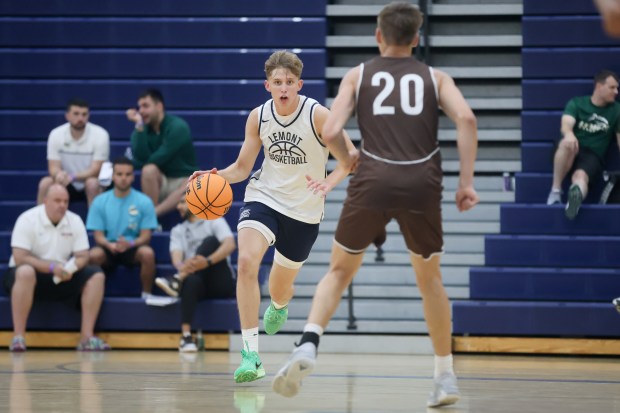 Lemont's Gabe Sularski (73) dribbles down court during a game against Mount Carmel in the Riverside-Brookfield Shootout on Saturday, June 22, 2024. (Troy Stolt/for the Daily Southtown)