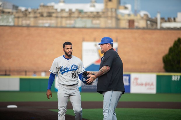 Windy City Thunderbolts' manager, Bobby Jenks talks with Emmanuel Sanchez at the end of an inning during a game against the Joliet Slammers, in Joliet on Saturday, July 20, 2024. (Vincent D. Johnson/for the Daily Southtown)