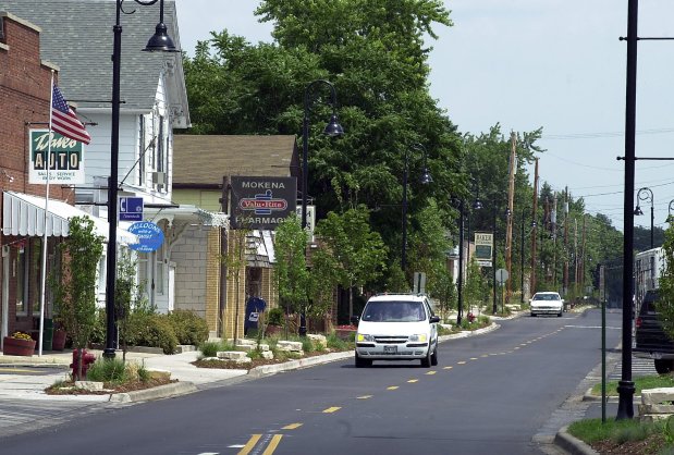 Front Street in Mokena July 19, 2001, when the village was rapidly changing from its agricultural roots to a modern suburb filled with subdivisions. One of the links to Mokena's dairy farming roots was destroyed in July 2024 by a powerful storm that knocked down a barn at First Street and Schoolhouse Road that was built around 1910. (Ed Wagner/Chicago Tribune)