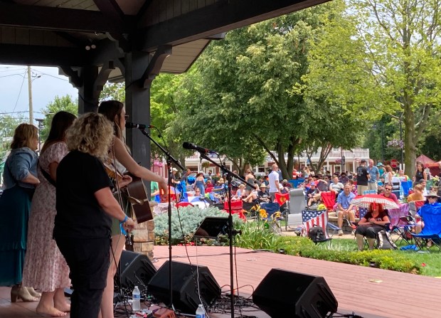 The band Sister Sadie performs Sunday, July 14, on the Breidert Green Stage during the 2024 Frankfort Bluegrass Festival in downtown Frankfort. The festival's three stages hosted 14 bands over its two-day run. (Paul Eisenberg/Daily Southtown)