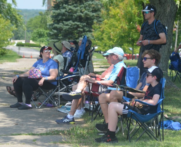 Vintage baseball fans find a shady tree to sit under July 13 2024, during a game between Blue Island and Lemont. (Jeff Vorva/for the Daily Southtown)