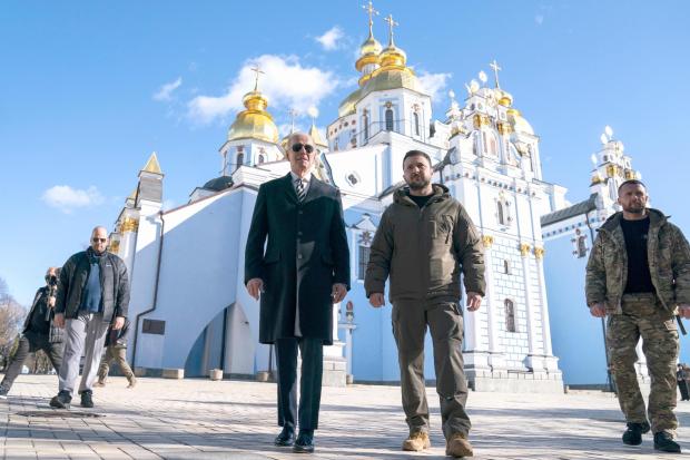 FILE - U.S. President Joe Biden walks with Ukrainian President Volodymyr Zelenskyy in Kyiv, Ukraine, Monday, Feb. 20, 2023. As chances rise of a Biden-Donald Trump rematch in the U.S. presidential election race, America's allies are bracing for a bumpy ride, with concerns rising that the U.S. could grow less dependable regardless of who wins. (AP Photo/ Evan Vucci, File)