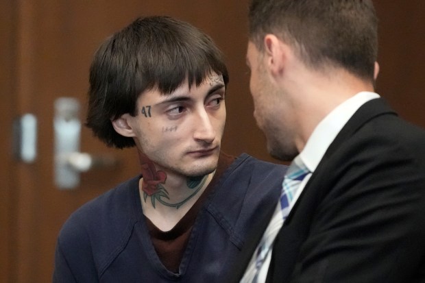 Robert Crimo III, left, talks to Lake County Assistant Public Defender Anton Trizna as he appears before Judge Victoria A. Rossetti at the Lake County Courthouse in Waukegan on June 26, 2024. Crimo III is charged with killing seven people and wounding dozens more in a shooting at an Independence Day parade in Highland Park. (Nam Y. Huh/AP)