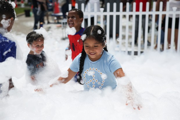 Anna Reyes, 6, plays in the bubble playground during the Bubble Works event put on by the Wonder Work Children's Museum in Oak Park on July 14, 2024. (Eileen T. Meslar/Chicago Tribune)