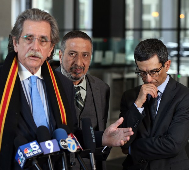 Attorney Thomas Durkin, from left, speaks to the media as Ahmed Daoud, the father of Adel Daoud, and attorney Joshua G. Herman look on at the Dirksen U.S. Courthouse in Chicago on May 6, 2019, after Adel Daoud's sentencing hearing. (Terrence Antonio James/Chicago Tribune)