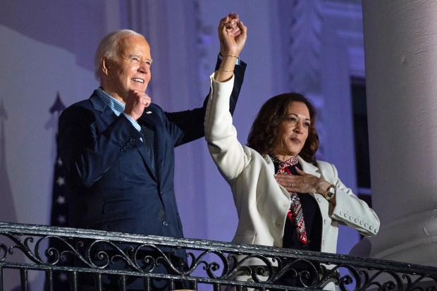 President Joe Biden raises the hand of Vice President Kamala Harris after viewing the Independence Day fireworks display over the National Mall from the balcony of the White House, Thursday, July 4, 2024, in Washington. She's already broken barriers, and now Harris could soon become the first Black woman to head a major party's presidential ticket after President Joe Biden's ended his reelection bid. The 59-year-old Harris was endorsed by Biden on Sunday, July 21, after he stepped aside amid widespread concerns about the viability of his candidacy. (Evan Vucci/AP)