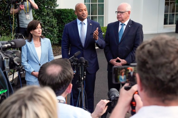 Maryland Gov. Wes Moore talks to reporters after meeting with President Joe Biden, July 3, 2024, at the White House, as New York Gov. Kathy Hochul and Minnesota Gov. Tim Walz listen. (Jacquelyn Martin/AP)