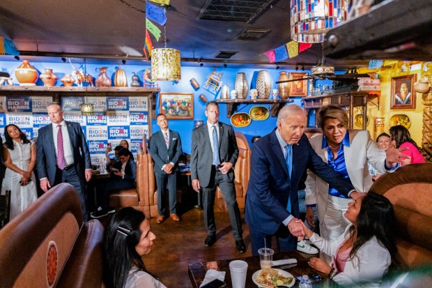 President Joe Biden greets patrons at The Original Lindo Michoacan restaurant in Las Vegas, on July 17, 2024. The president's appearance, and his campaign's momentum, changed dramatically during a two-day swing in Nevada that was cut short when he tested positive for Covid. (Eric Lee/The New York Times)