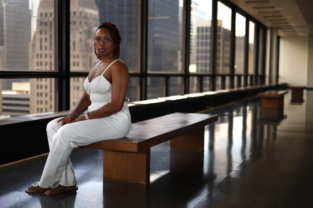 Dominique Ward sits outside of the courtrooms on the 19th floor of the Daley Center, July 3, 2024, where she has had to come in order to stop the electronic harassment by her children's father. (Stacey Wescott/Chicago Tribune)