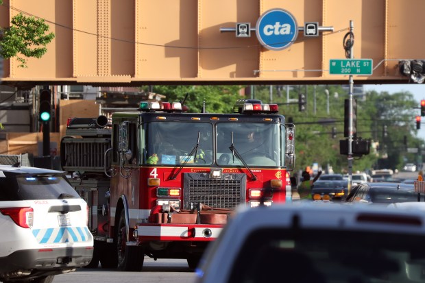 A Chicago Fire Department equipment heads toward an extra-alarm blaze at a pallet yard on June 18, 2024. (Terrence Antonio James/Chicago Tribune)