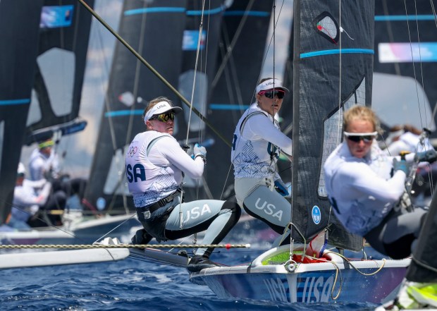 USA's Maggie Shea, left, and Stephanie Roble compete in a women's skiff sailing race, July 28, 2024, at Marseille Marina during the Paris Olympics. (Brian Cassella/Chicago Tribune)