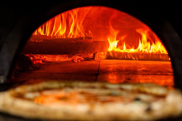 Pizza and a very hot wood-fired oven at Pizzeria O'Barone in Naples, Italy. (Paolo Manzo/Getty)