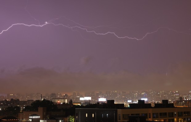 Lightening streaks across the skyline covered in clouds during a thunderstorm on July 15, 2024, in Chicago. (John J. Kim/Chicago Tribune)