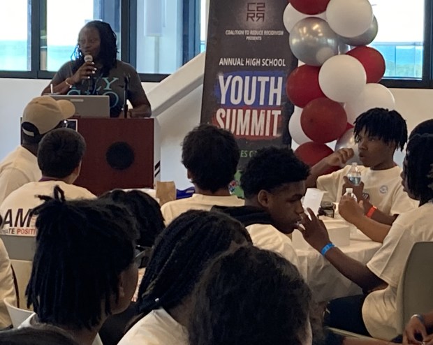 Waukegan High School graduate and 2004 Olympic sprinter Shakededia Jones talks to students at the teen summit. Steve Sadin/Lake County News-Sun)