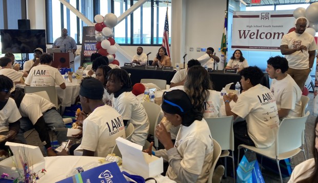 Participants in the 10th-annual Waukegan Township Coalition to Reduce Recidivism Teen Summit listen to a panel discussion during lunch. (Steve Sadin/Lake County News-Sun)