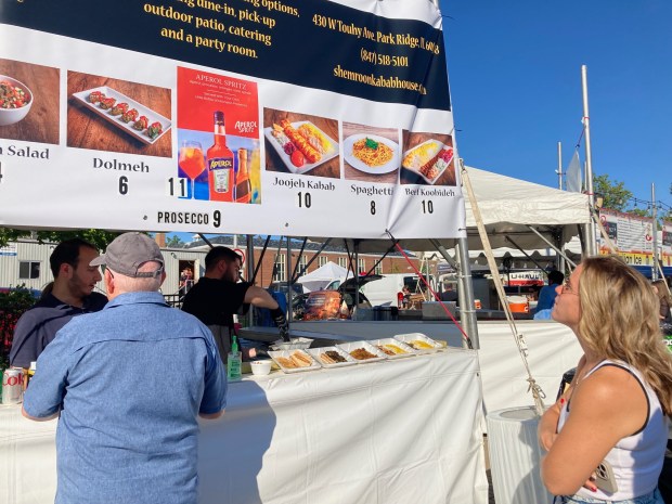 Fest-goers check out Shemroom Kabab's offerings at Taste of Park Ridge on July 18, 2024. (Pam DeFiglio, Chicago Tribune/Pioneer Press)