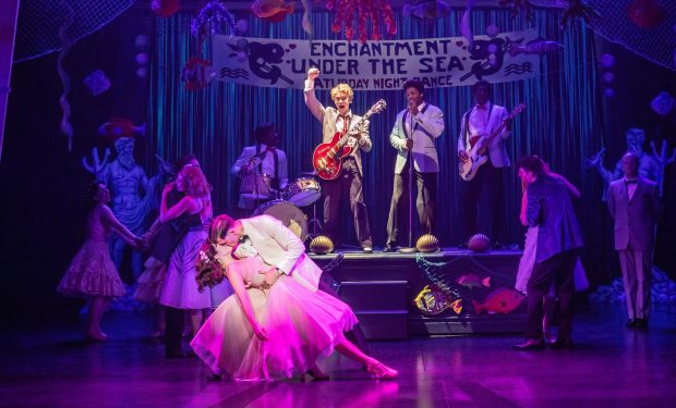 Zan Berube, Burke Swanson, Caden Brauch and company in the touring production of "Back to the Future: The Musical" at the Cadillac Palace Theatre in Chicago. (Matthew Murphy and Evan Zimmerman)