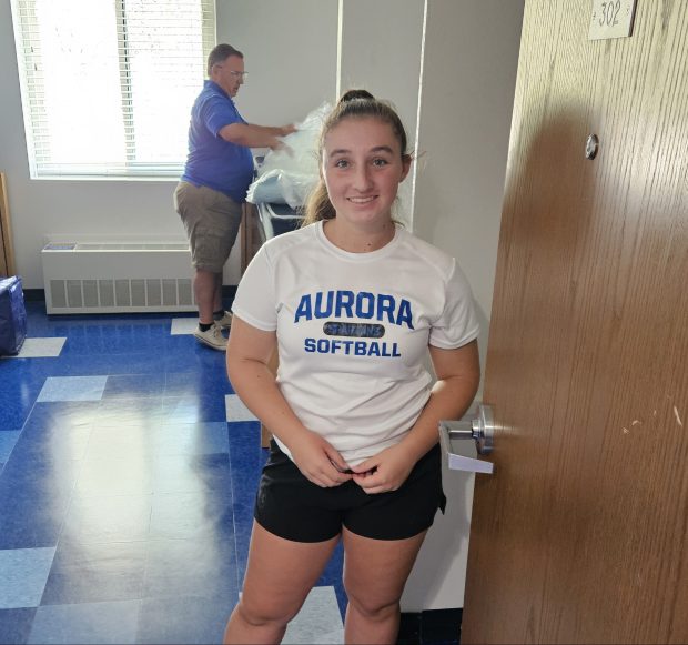 Freshman Kelsey Oviatt of Newark, California, is looking forward to playing softball and studying to become a firefighters at Aurora University, which welcomed freshmen and first-time students into the dorms Friday morning. (David Sharos / For The Beacon-News)