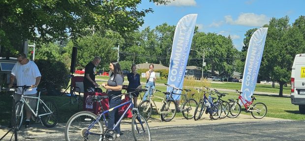 Bikes get dropped off outside Community Christian Church in Aurora on Saturday where a free bicycle repair clinic was offered. (David Sharos / For The Beacon-News)