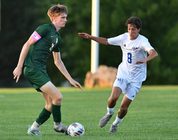 Waubonsie Valley's Cade Valek dribbles the ball away from Marmion's Emilio Morones (8) during a game on Thursday, Aug. 29, 2024 in Aurora...(Jon Cunningham/for The Beacon-News)