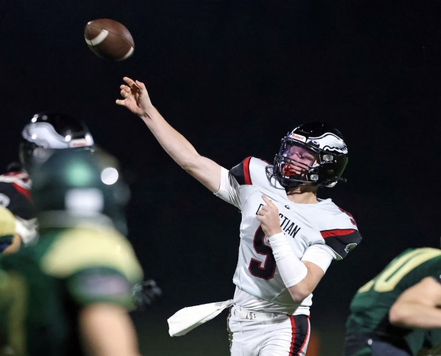 Aurora Christian's backup quarterback Asa Johnson (5) throws a touchdown pass to Jonan Miceli in the third quarter against St. Edward during a Chicagoland Christian Conference game Friday, Sept. 15, 2023 in Elgin. Aurora Christian won, 46-0. H. Rick Bamman / For the Beacon-News