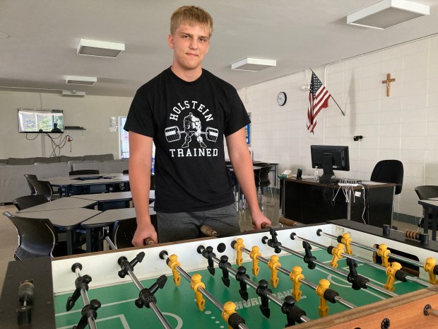 Foosball provides a respite for Marmion's Mateusz Nycz before the start of practice in Aurora on Monday, Aug. 26, 2024. (Rick Armstrong/ The Beacon-News)