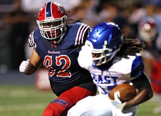 West Aurora's Jesse Estrella (62), chases Proviso East's Jamaris Thomas (12), in the first quarter during a nonconference game in Aurora on Friday, Sept. 30, 2024. West Aurora won, 53-0.(H. Rick Bamman / The Beacon-News)