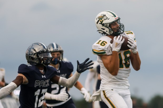 Waubonsie Valley's Colin Ford (16) makes a catch during a game against Oswego East in Oswego on Friday Aug. 30, 2024. (Troy Stolt / The Beacon News)